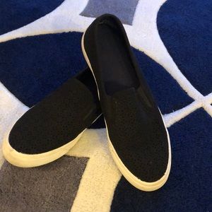 Black Sperry sneakers with lace like detail